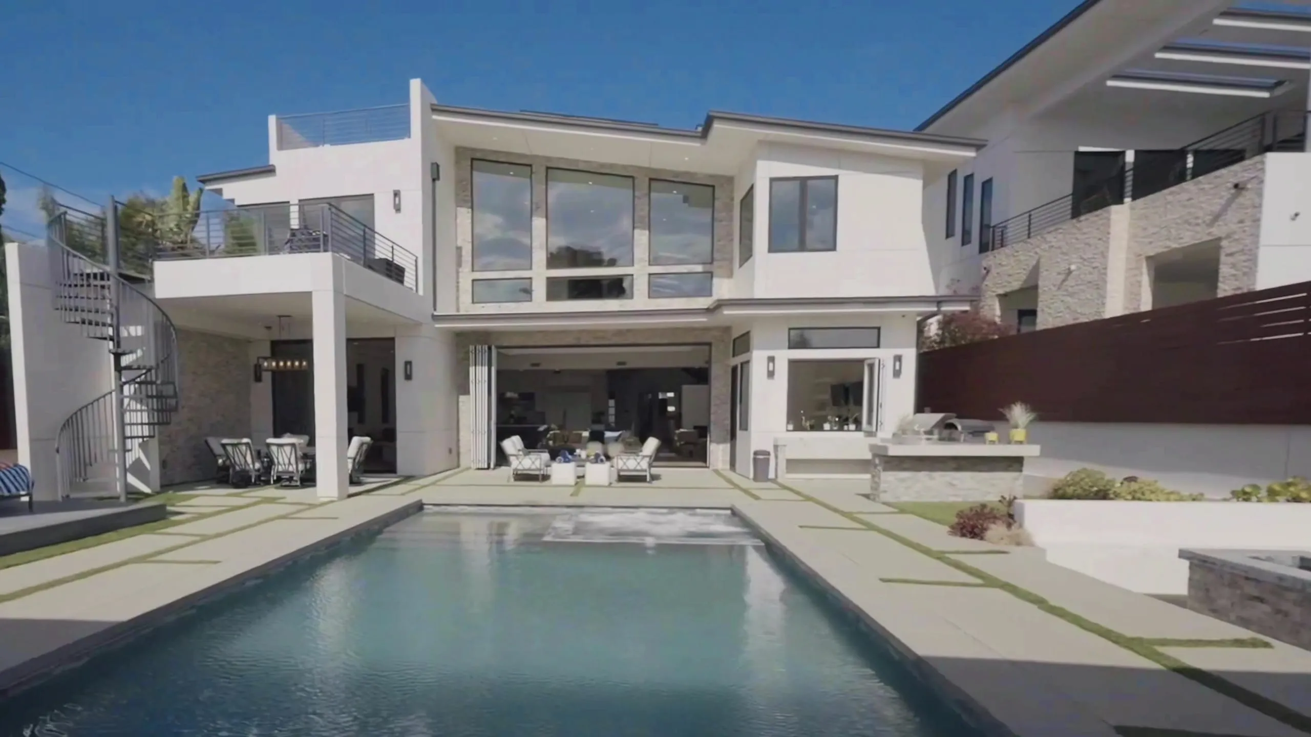 503 South Lucia at dusk — the modern home, pool, and backyard