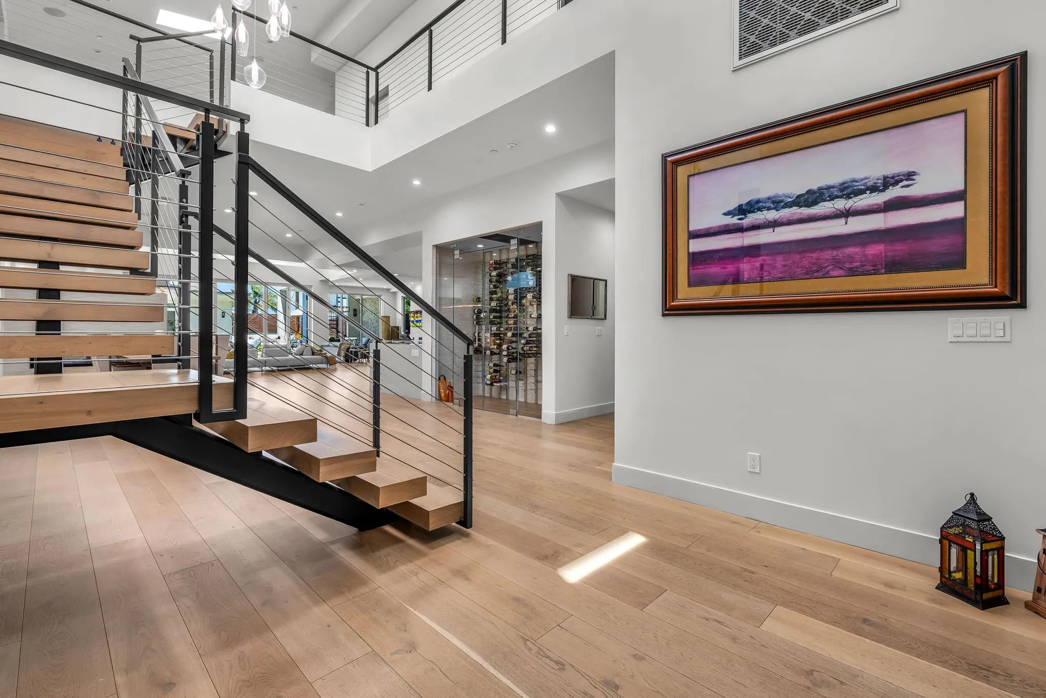 Entry foyer with the floating staircase